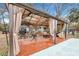 Relaxing covered patio with seating and outdoor grill at 2007 Central Ave, Summerville, SC 29483