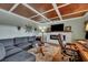 Spacious living room with sectional sofa, coffered ceiling, and built-in electric fireplace at 2007 Central Ave, Summerville, SC 29483
