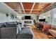 Cozy living room with sectional sofa, workspace, and coffered ceiling at 2007 Central Ave, Summerville, SC 29483