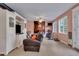 Recreation room with built-in shelving, comfortable seating, and access to other rooms at 2007 Central Ave, Summerville, SC 29483