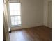 Spacious bedroom with wood-look floors and a window at 201 Regent St, Summerville, SC 29483