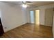 Spacious bedroom with hardwood floors and ceiling fan at 201 Regent St, Summerville, SC 29483