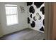 Bright bedroom featuring a cow-themed accent wall at 201 Regent St, Summerville, SC 29483