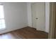 Empty bedroom with wood-look flooring and large window at 201 Regent St, Summerville, SC 29483
