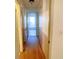 Long hallway with light walls and wood flooring at 201 Regent St, Summerville, SC 29483