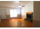 Bright living room featuring hardwood floors and a fireplace at 201 Regent St, Summerville, SC 29483