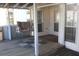 Covered porch with swing, string lights, and wood flooring at 201 Regent St, Summerville, SC 29483
