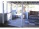 Relaxing screened porch with swing and wood flooring at 201 Regent St, Summerville, SC 29483