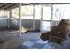 Screened porch with hanging swing and wood flooring at 201 Regent St, Summerville, SC 29483