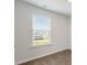 Bright bedroom with wood-look floors and a window with blinds at 217 Terrace View Dr, Summerville, SC 29486