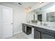 Elegant bathroom with double vanity, dark cabinets, and a large mirror at 264 Godwit Dr, Summerville, SC 29486