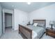 Well-lit bedroom with wood bed frame and double doors leading to a closet at 264 Godwit Dr, Summerville, SC 29486