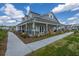 Community clubhouse with porch and landscaping at 264 Godwit Dr, Summerville, SC 29486