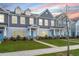 Two-story townhouses with gray siding, light-colored trim, and landscaping at 264 Godwit Dr, Summerville, SC 29486