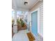 Light blue front door with welcome mat and brick porch at 264 Godwit Dr, Summerville, SC 29486
