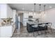 Open kitchen with granite island, white cabinets and stainless steel appliances at 264 Godwit Dr, Summerville, SC 29486