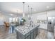 Open concept kitchen with island, granite countertops, and stainless steel appliances at 264 Godwit Dr, Summerville, SC 29486