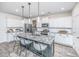 Modern kitchen with white cabinets, granite countertops, and a large island at 264 Godwit Dr, Summerville, SC 29486