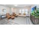Living room featuring hardwood floors, a sofa, armchairs, and a large TV at 264 Godwit Dr, Summerville, SC 29486