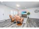 Living room with hardwood floors, comfortable seating, and large windows at 264 Godwit Dr, Summerville, SC 29486
