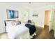 Cozy bedroom with a queen-size bed, hardwood floors, and large window at 2744 E Surrey Dr, North Charleston, SC 29405