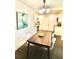 Bright dining area with wood table and chairs, hardwood floors, and adjacent kitchen at 2744 E Surrey Dr, North Charleston, SC 29405
