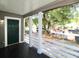Inviting front porch with white railings and a view of the street at 2744 E Surrey Dr, North Charleston, SC 29405