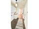 Clean hallway with hardwood floors, laundry area and access to other rooms at 2744 E Surrey Dr, North Charleston, SC 29405