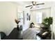 Home office with hardwood floors, two armchairs, and natural light from two windows at 2744 E Surrey Dr, North Charleston, SC 29405
