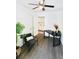 Bright home office with hardwood floors, ceiling fan, and built-in workspace at 2744 E Surrey Dr, North Charleston, SC 29405