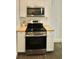 Updated kitchen with stainless steel appliances and butcher block countertops at 2744 E Surrey Dr, North Charleston, SC 29405