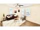 Living room with hardwood floors, comfy seating, and a large window at 2744 E Surrey Dr, North Charleston, SC 29405