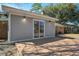 Backyard with wooden deck and sliding doors at 303 Longleaf Rd, Summerville, SC 29486