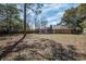 Overhead view of a backyard with wooden fence and a home with a brick chimney at 303 Longleaf Rd, Summerville, SC 29486