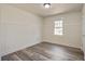 Cozy bedroom featuring a single window and stylish plank flooring and neutral paint at 303 Longleaf Rd, Summerville, SC 29486