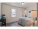 Relaxing bedroom with neutral tones, wood floors, and an ensuite bathroom at 303 Longleaf Rd, Summerville, SC 29486