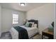 Comfortable bedroom featuring a bed, hardwood floors, and a well-lit window at 303 Longleaf Rd, Summerville, SC 29486