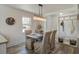 Bright dining room with decorative table setting, stylish lighting and wood floors at 303 Longleaf Rd, Summerville, SC 29486