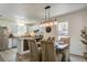 Cozy dining area with stylish chandelier, adjacent to a modern kitchen with stainless steel appliances at 303 Longleaf Rd, Summerville, SC 29486