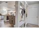 Bright entryway with coat rack, built-in bench, and open view to the dining and kitchen areas at 303 Longleaf Rd, Summerville, SC 29486