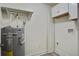 Utility room featuring water heater, cabinets, and a clean, functional design at 303 Longleaf Rd, Summerville, SC 29486