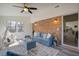 Stylish living room with brick accent wall, plush seating, and open access to kitchen at 303 Longleaf Rd, Summerville, SC 29486