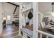 Open-concept living room showcasing a brick fireplace, beamed ceiling, and stylish decor at 303 Longleaf Rd, Summerville, SC 29486