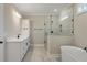 Spa-like bathroom with a soaking tub, large shower, and modern fixtures at 7210 Raw Dew Dr, Awendaw, SC 29429