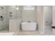 Elegant bathroom featuring a freestanding bathtub and a glass shower at 7210 Raw Dew Dr, Awendaw, SC 29429