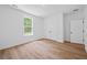 Bright bedroom features a window and wood-look floors; two closets provide ample storage space at 7210 Raw Dew Dr, Awendaw, SC 29429