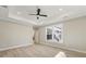 Bright and airy bedroom with hardwood floors and large windows at 7210 Raw Dew Dr, Awendaw, SC 29429