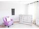 Bedroom features a crib, rocking chair, and wall hanging at 778 Opal Wing St, Moncks Corner, SC 29461