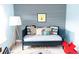 Stylish bedroom with daybed and geometric wallpaper at 778 Opal Wing St, Moncks Corner, SC 29461