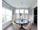 Sunlit dining area featuring a round table and four chairs, neutral color palette at 778 Opal Wing St, Moncks Corner, SC 29461